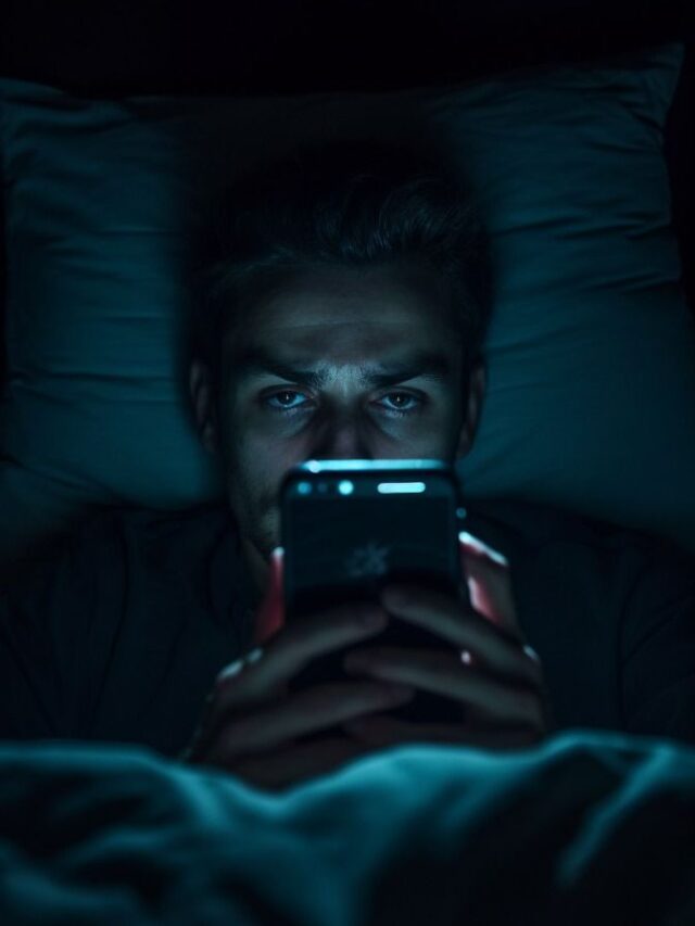Worried man looking at his phone late at night after an important decision
